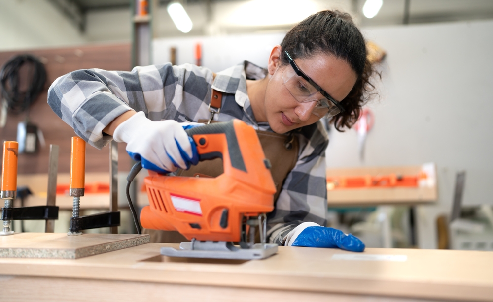 Woman using a saw